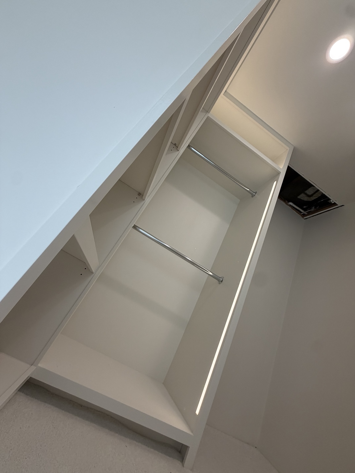 Painted closet shelving with lighting
